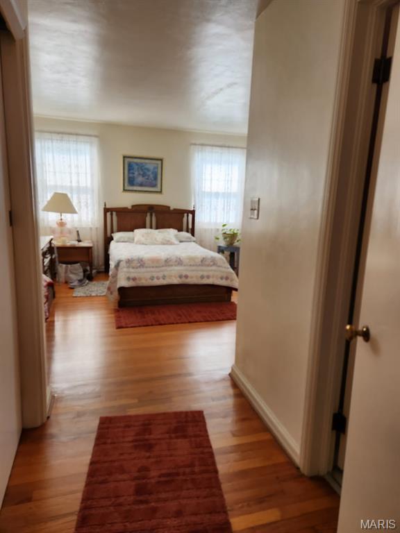 209 Highley Ln, Desloge, MO 63628 - bedroom featuring multiple windows and light wood-type flooring