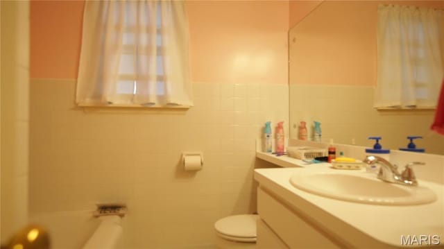 209 Highley Ln, Desloge, MO 63628 - full bath with vanity, wainscoting, a bath, and tile walls