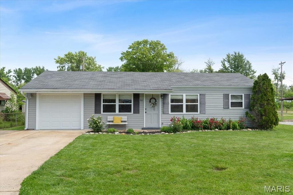 307 Weber Dr, Eureka, MO 63025 - ranch-style house with a garage, concrete driveway, and a front yard
