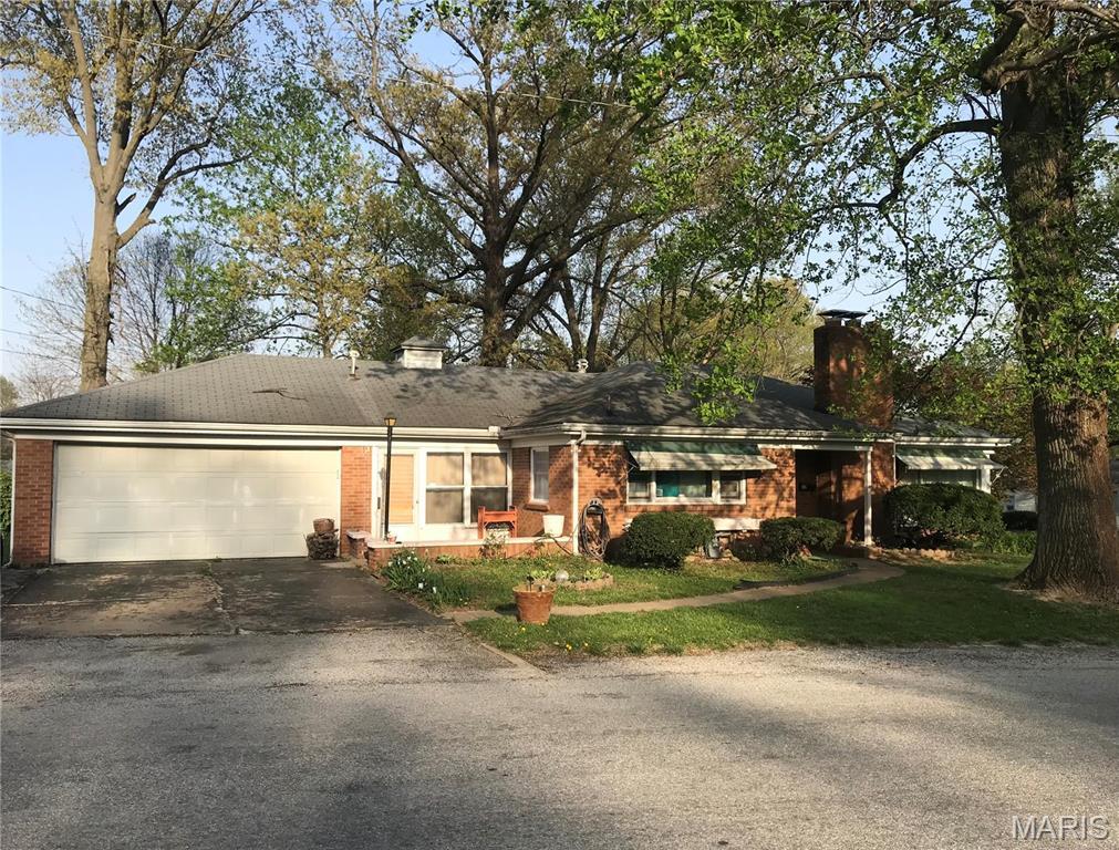 245 Oliver Lee Dr, Belleville, IL 62223 - ranch-style house with a chimney, driveway, brick siding, and an attached garage