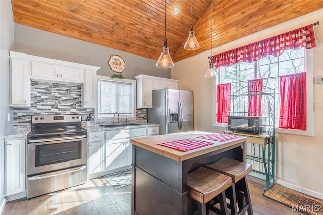 249 Trails End Way, Doniphan, MO 63935 - kitchen featuring stainless steel appliances, wood ceiling, a sink, white cabinetry, and decorative backsplash