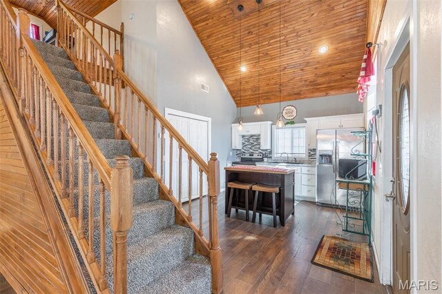 249 Trails End Way, Doniphan, MO 63935 - stairway featuring wooden ceiling, high vaulted ceiling, wood-type flooring, and recessed lighting