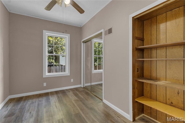 317 S Louisiana St, Cape Girardeau, MO 63703 - spare room featuring ornamental molding, wood finished floors, baseboards, and a ceiling fan