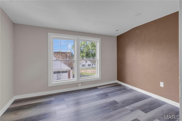 317 S Louisiana St, Cape Girardeau, MO 63703 - spare room with wood finished floors and baseboards