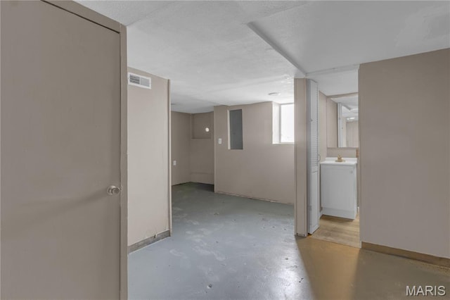 317 S Louisiana St, Cape Girardeau, MO 63703 - empty room featuring concrete floors, baseboards, and electric panel