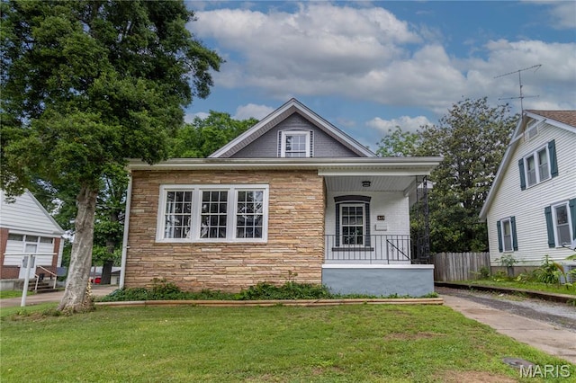 317 S Louisiana St, Cape Girardeau, MO 63703 - bungalow with stone siding and a porch
