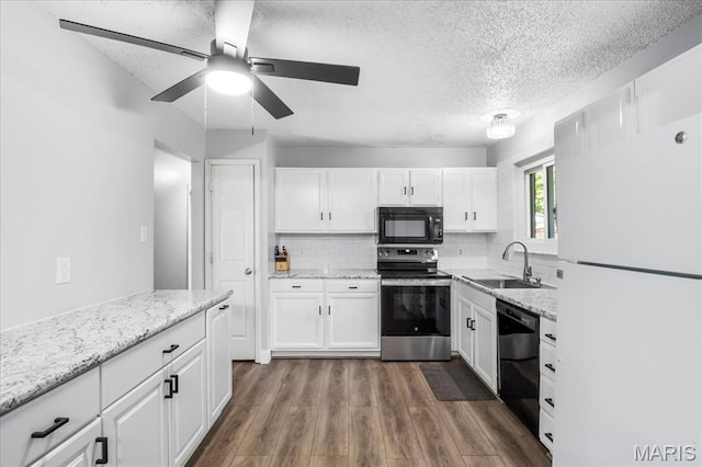 1748 Scenic Meadows Dr, Imperial, MO 63052 - kitchen with black appliances, a sink, a textured ceiling, white cabinetry, and dark wood finished floors