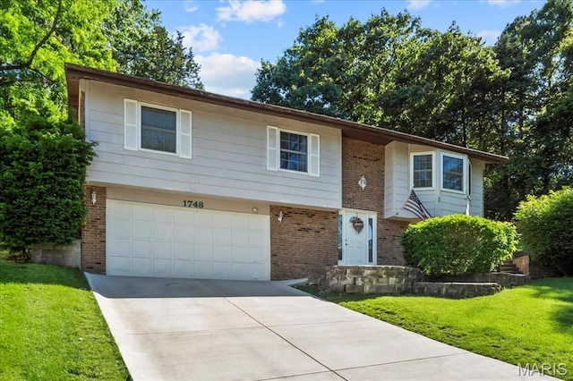 1748 Scenic Meadows Dr, Imperial, MO 63052 - bi-level home featuring brick siding, a garage, a front yard, and driveway