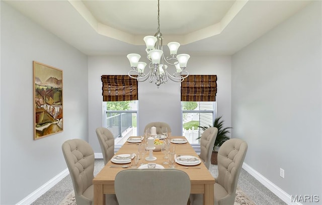 3 Lakeview Pointe Ct, Lake St Louis, MO 63367 - carpeted dining area featuring a tray ceiling, a chandelier, and baseboards