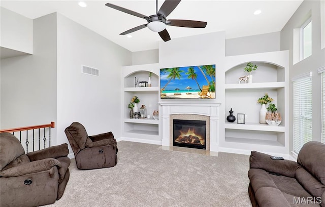 3 Lakeview Pointe Ct, Lake St Louis, MO 63367 - carpeted living room with built in shelves, a ceiling fan, baseboards, a fireplace with flush hearth, and recessed lighting