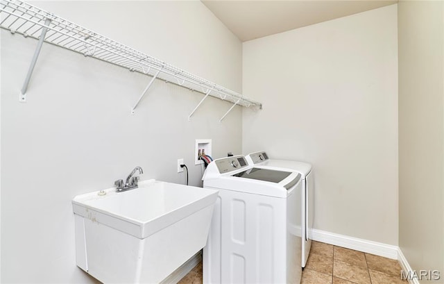 3 Lakeview Pointe Ct, Lake St Louis, MO 63367 - laundry room with separate washer and dryer, baseboards, and light tile patterned flooring
