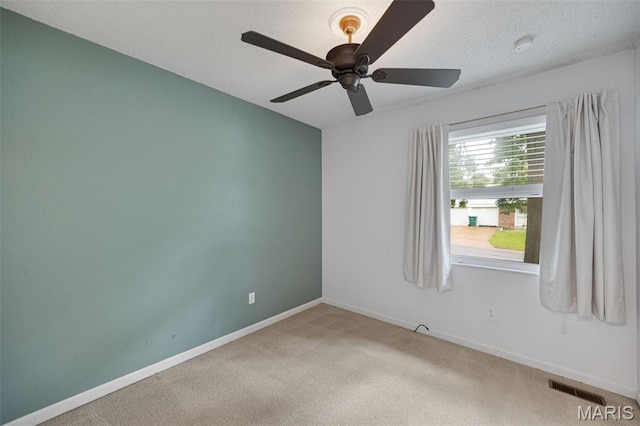 2794 Pinebrook Dr, Arnold, MO 63010 - carpeted spare room featuring a ceiling fan, baseboards, and a textured ceiling