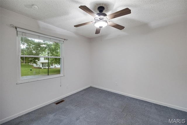 2794 Pinebrook Dr, Arnold, MO 63010 - empty room featuring dark colored carpet, a ceiling fan, a textured ceiling, and baseboards