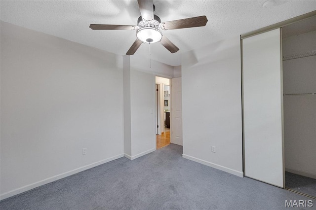 2794 Pinebrook Dr, Arnold, MO 63010 - unfurnished bedroom featuring carpet, baseboards, a textured ceiling, a closet, and a ceiling fan
