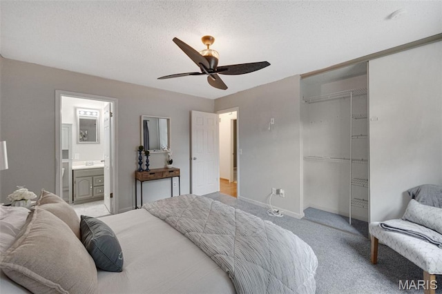 2794 Pinebrook Dr, Arnold, MO 63010 - bedroom featuring a closet, light carpet, a ceiling fan, baseboards, and ensuite bathroom