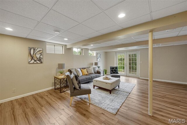 2794 Pinebrook Dr, Arnold, MO 63010 - living area featuring baseboards, wood finished floors, a drop ceiling, recessed lighting, and french doors
