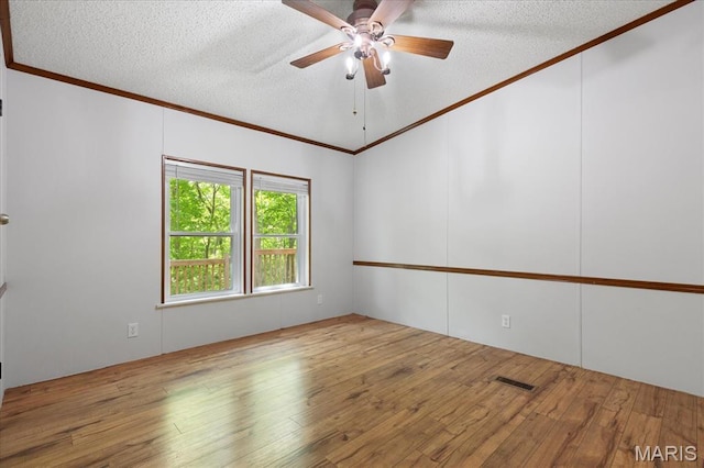 unfurnished room with ornamental molding, a textured ceiling, hardwood / wood-style flooring, and ceiling fan