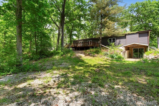 view of yard with a deck