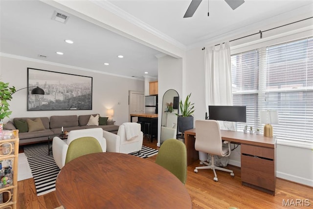 5621 Pershing Ave Unit 21, Saint Louis, MO 63112 - dining area featuring ornamental molding, light wood-type flooring, ceiling fan, an office area, and baseboards