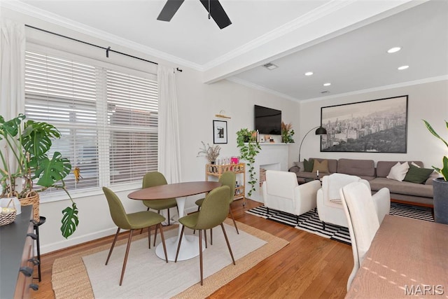 5621 Pershing Ave Unit 21, Saint Louis, MO 63112 - dining room featuring light wood-style flooring, crown molding, ceiling fan, recessed lighting, and baseboards