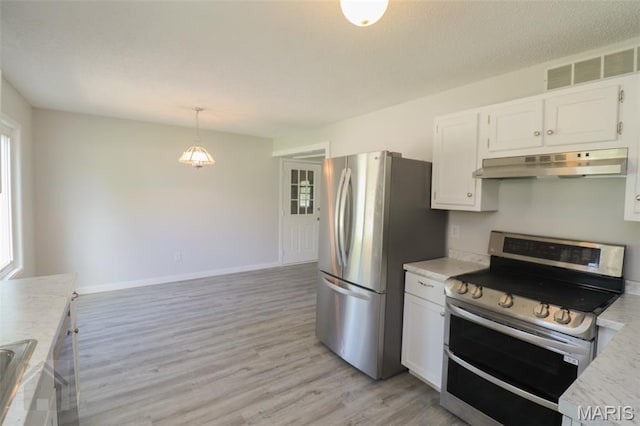 104 Wild Rose Pl, Saint Robert, MO 65584 - kitchen with stainless steel appliances, under cabinet range hood, light countertops, white cabinetry, and light wood-type flooring
