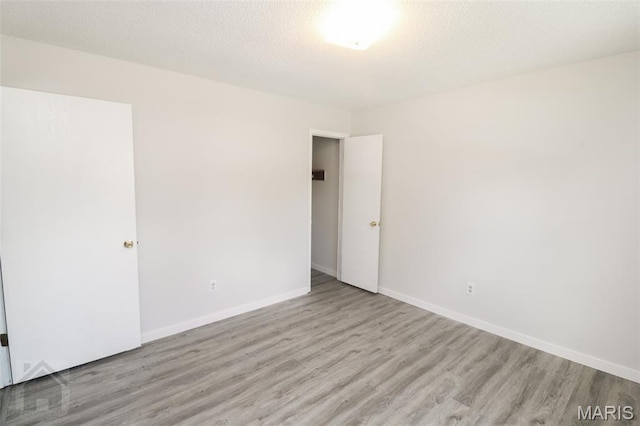 104 Wild Rose Pl, Saint Robert, MO 65584 - spare room featuring wood finished floors