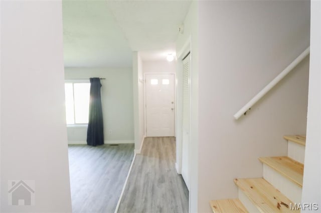 104 Wild Rose Pl, Saint Robert, MO 65584 - corridor featuring stairway and wood finished floors