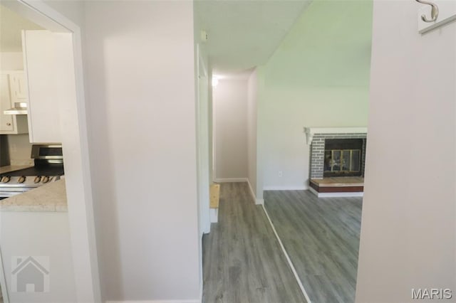 104 Wild Rose Pl, Saint Robert, MO 65584 - hall with wood finished floors and baseboards