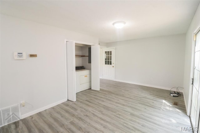 104 Wild Rose Pl, Saint Robert, MO 65584 - spare room featuring washer / clothes dryer and light wood finished floors