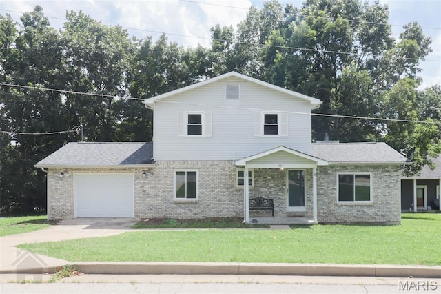 104 Wild Rose Pl, Saint Robert, MO 65584 - traditional home featuring an attached garage, brick siding, a front lawn, driveway, and a shingled roof