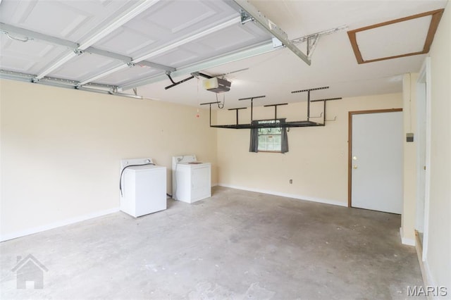 104 Wild Rose Pl, Saint Robert, MO 65584 - garage with a garage door opener and washing machine and dryer