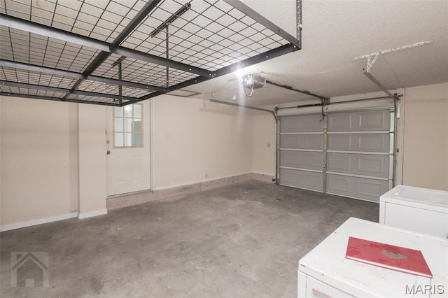 104 Wild Rose Pl, Saint Robert, MO 65584 - garage with a garage door opener and baseboards