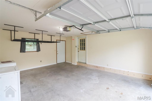 104 Wild Rose Pl, Saint Robert, MO 65584 - garage with separate washer and dryer and a garage door opener