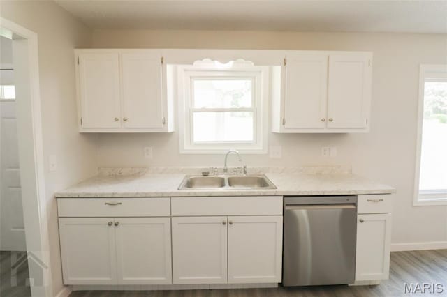 104 Wild Rose Pl, Saint Robert, MO 65584 - kitchen featuring dishwasher, white cabinets, healthy amount of natural light, and wood finished floors