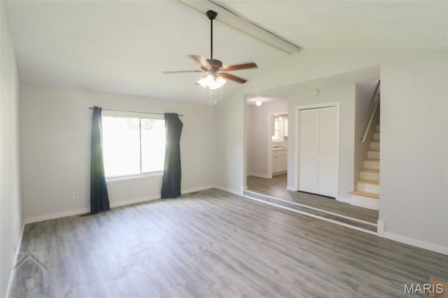 104 Wild Rose Pl, Saint Robert, MO 65584 - unfurnished room featuring wood finished floors, stairway, and a ceiling fan