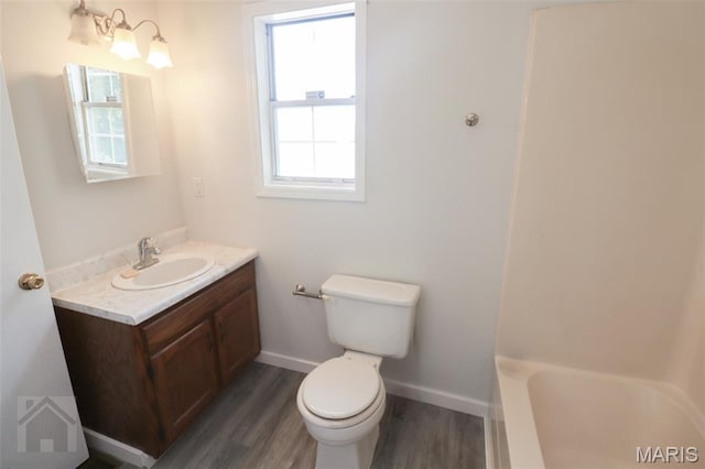 104 Wild Rose Pl, Saint Robert, MO 65584 - bathroom with vanity, wood finished floors, and a chandelier