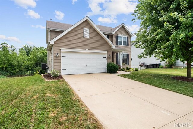 9421 Marbarry Dr, Fairview Heights, IL 62208 - traditional home with a front lawn, concrete driveway, and an attached garage