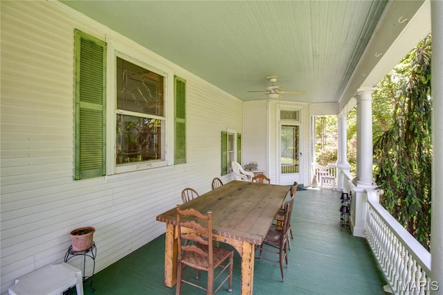 619 E Main St, Carlinville, IL 62626 - wooden deck featuring a ceiling fan, a porch, and outdoor dining space