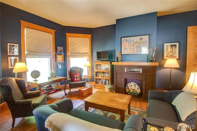 619 E Main St, Carlinville, IL 62626 - living room with wood finished floors and a brick fireplace