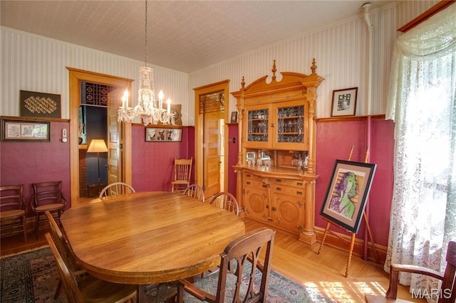 619 E Main St, Carlinville, IL 62626 - dining area featuring a chandelier, wood finished floors, ornamental molding, and baseboards