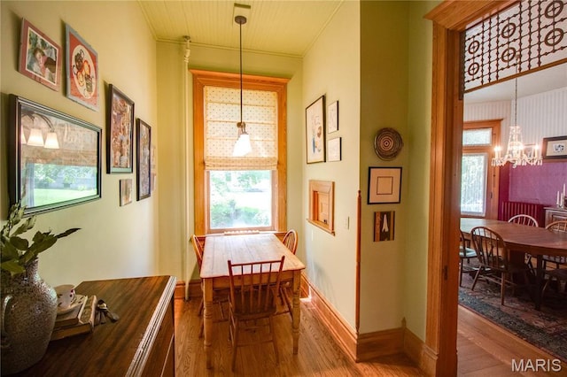 619 E Main St, Carlinville, IL 62626 - corridor featuring a chandelier, wood finished floors, and baseboards