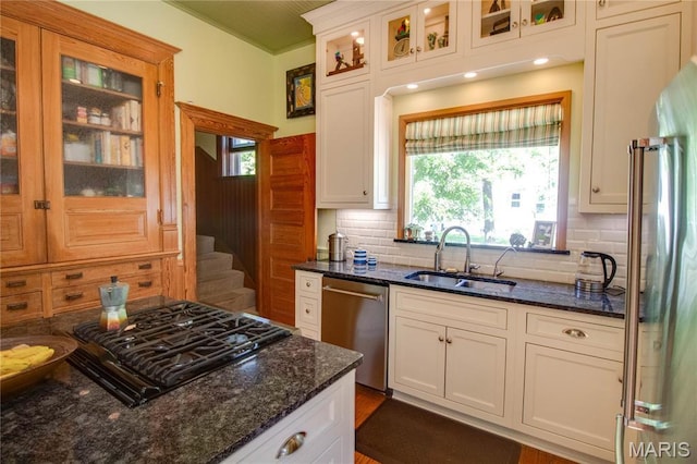 619 E Main St, Carlinville, IL 62626 - kitchen with a sink, appliances with stainless steel finishes, backsplash, and dark stone countertops