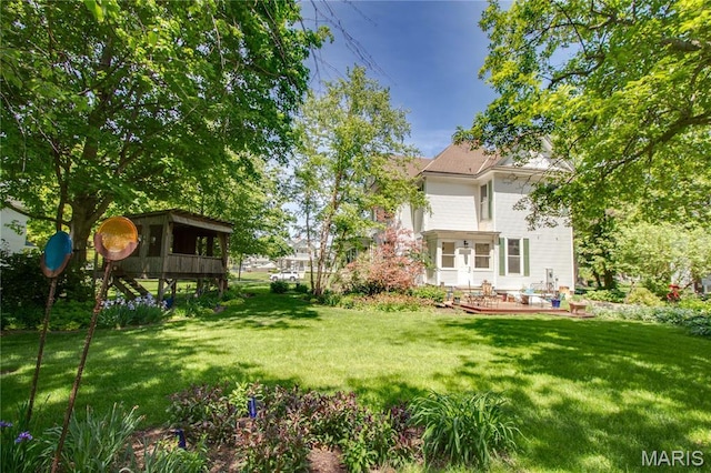 619 E Main St, Carlinville, IL 62626 - view of green lawn with a wooden deck