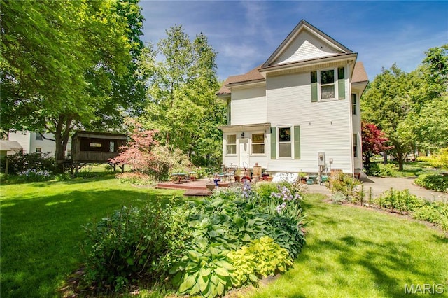 619 E Main St, Carlinville, IL 62626 - back of property featuring a yard and a wooden deck