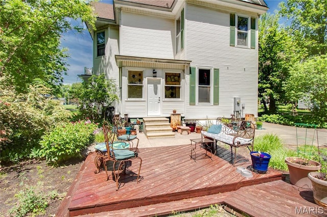 619 E Main St, Carlinville, IL 62626 - back of property with entry steps and a wooden deck