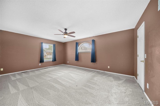 14 Sunderland Ct, Saint Charles, MO 63303 - carpeted empty room with ceiling fan, baseboards, and a textured ceiling
