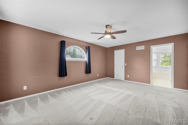 14 Sunderland Ct, Saint Charles, MO 63303 - carpeted empty room featuring a ceiling fan, a textured ceiling, and baseboards