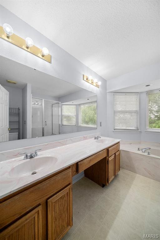 14 Sunderland Ct, Saint Charles, MO 63303 - full bathroom with a textured ceiling, double vanity, a bath, and a shower stall