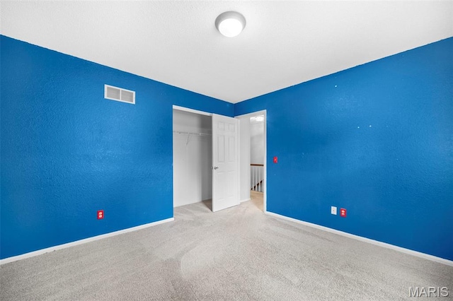 14 Sunderland Ct, Saint Charles, MO 63303 - unfurnished bedroom featuring carpet floors, a closet, and baseboards
