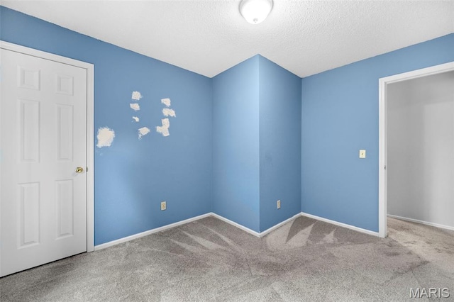 14 Sunderland Ct, Saint Charles, MO 63303 - unfurnished room featuring carpet, baseboards, and a textured ceiling